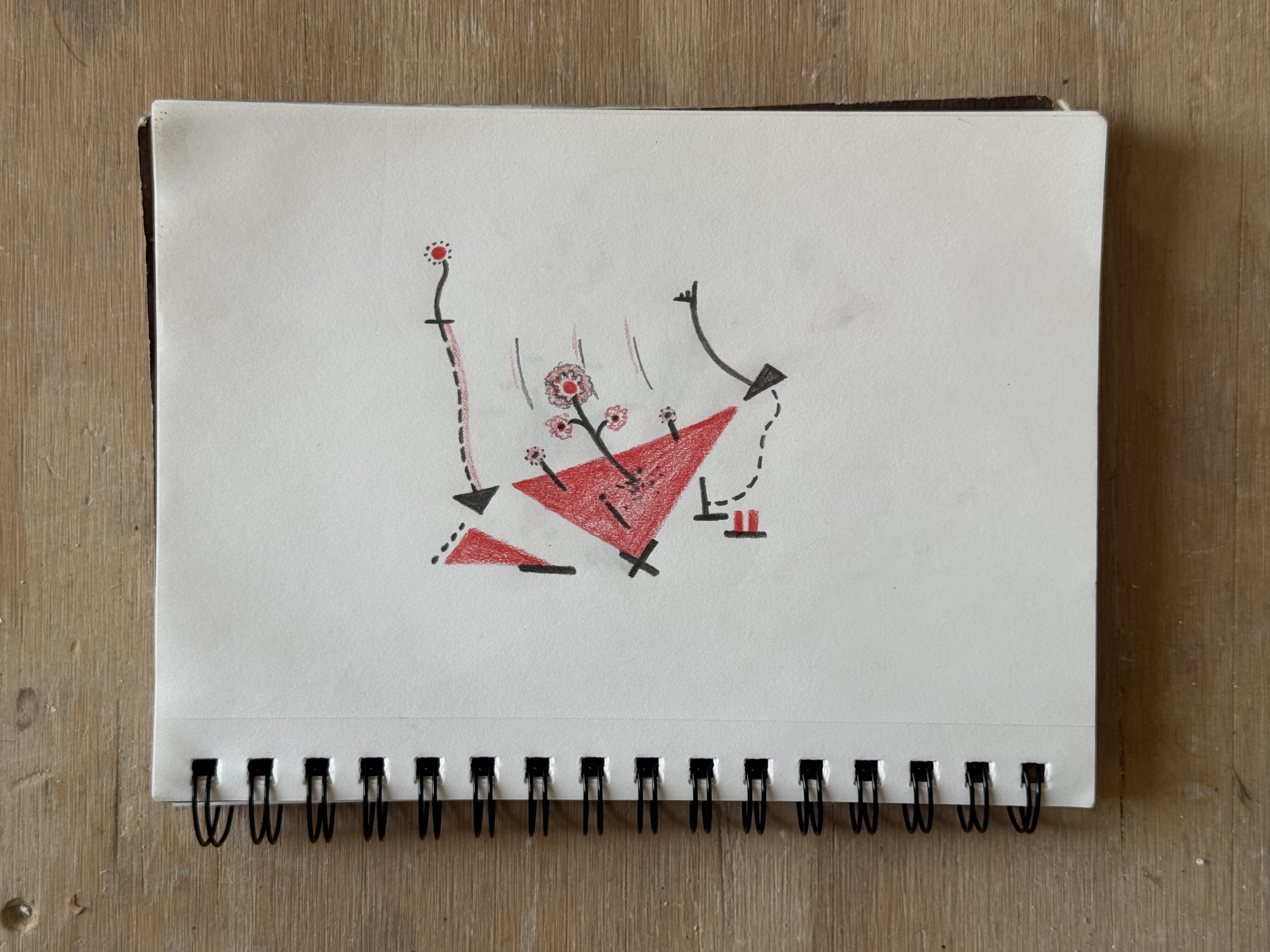 an abstract red and black pencil drawing of some triangles and what appears to be flowers growing on one of the large red triangles.